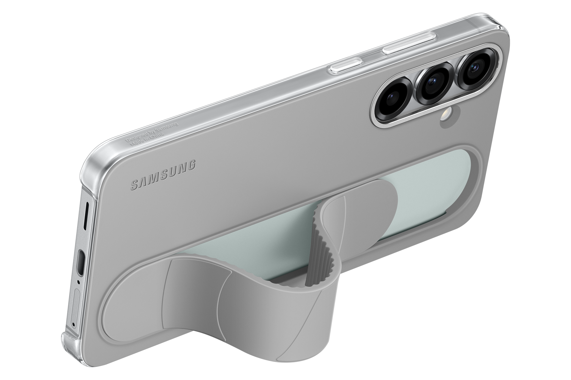 Szary telefon Samsung w szarym etui z podstawką. Telefon ma trzy obiektywy aparatu. Etui posiada uchwyt na palec.