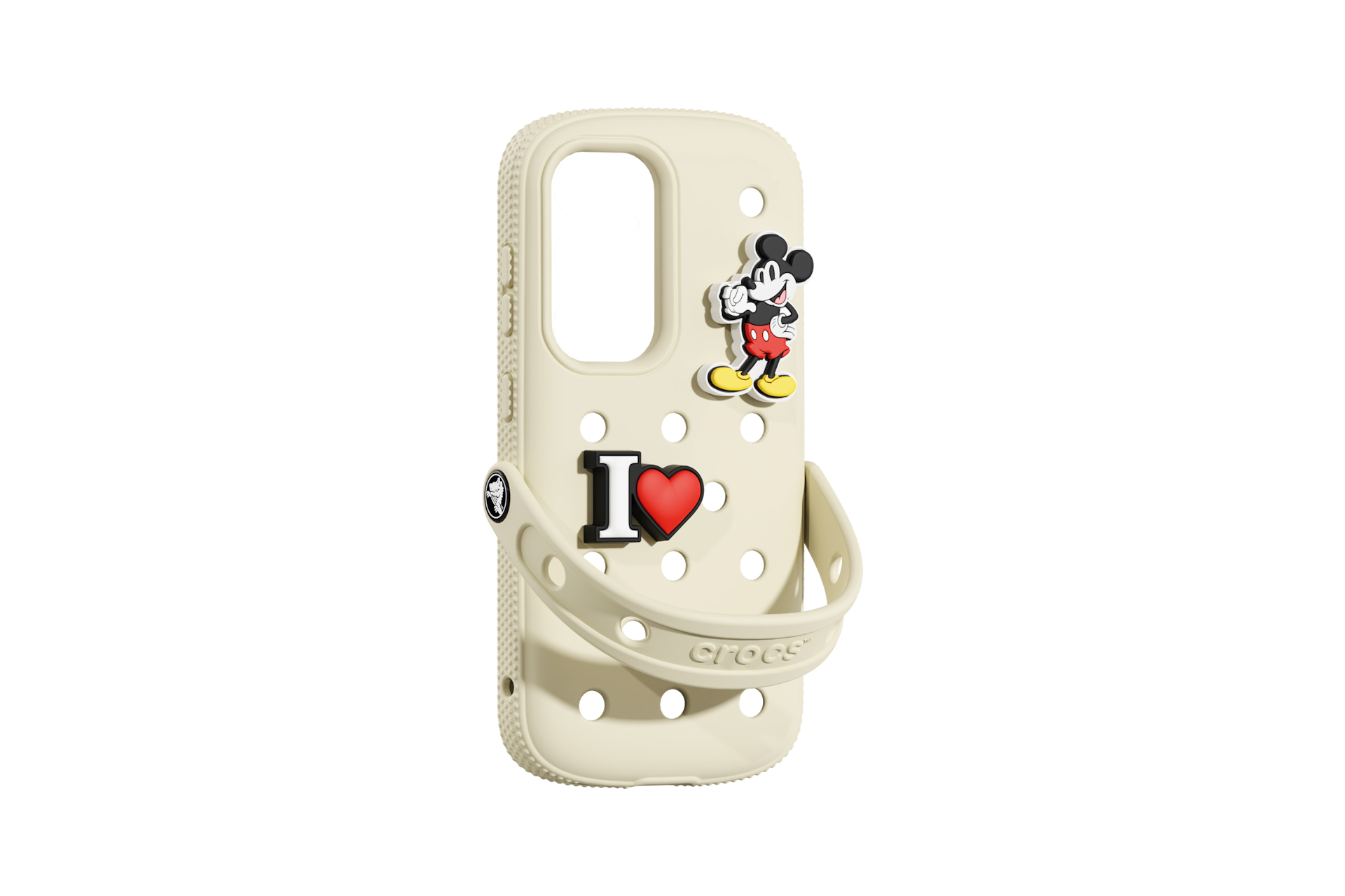 Una custodia per telefono Crocs color crema con Topolino e un ciondolo 'I love' su sfondo nero.
