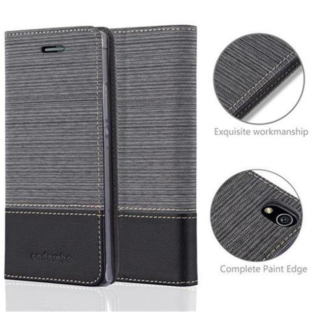 Una funda gris para teléfono con parte inferior negra. Los detalles de la funda se muestran en insertos circulares con texto.