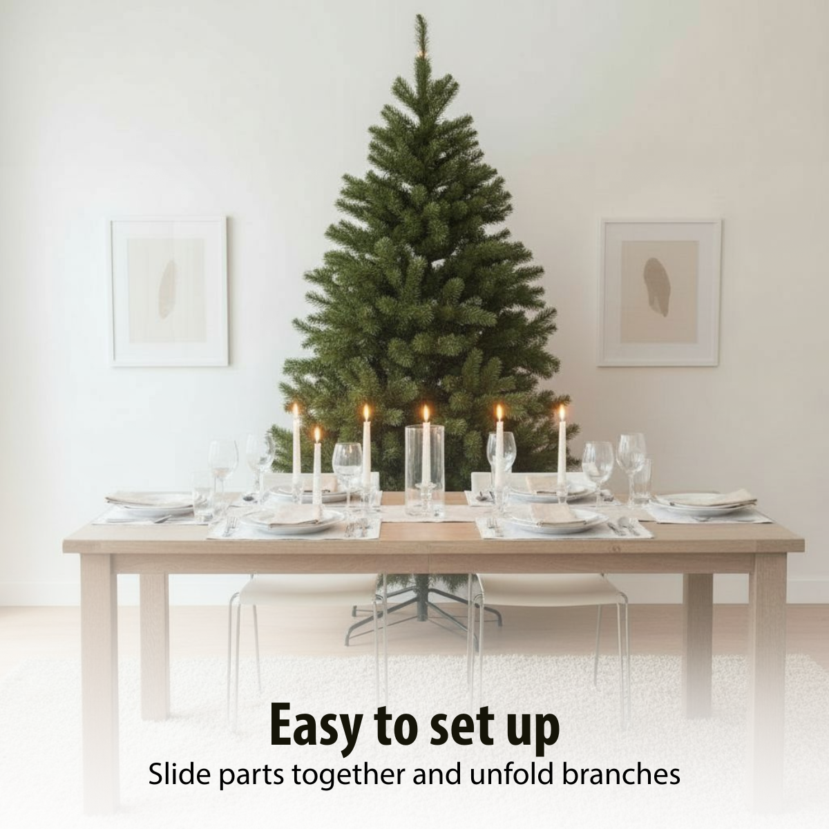 A dining table with place settings, lit candles, and a Christmas tree in the background. Two framed pictures hang on the wall.