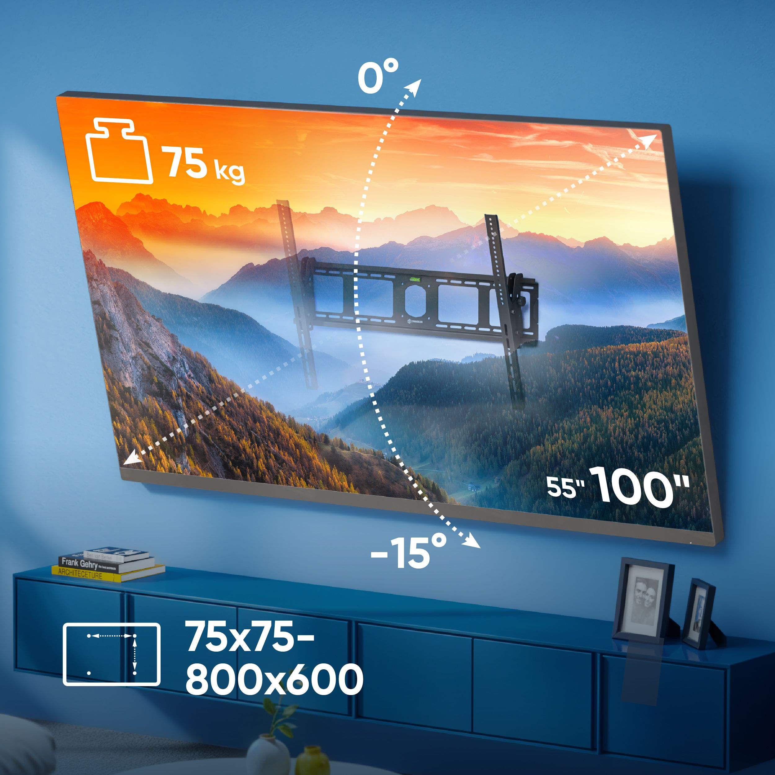 Telewizor z uchwytem, specyfikacją wyświetlacza i szczegółami wagi. Poniżej niebieska szafka z książkami i ramkami.