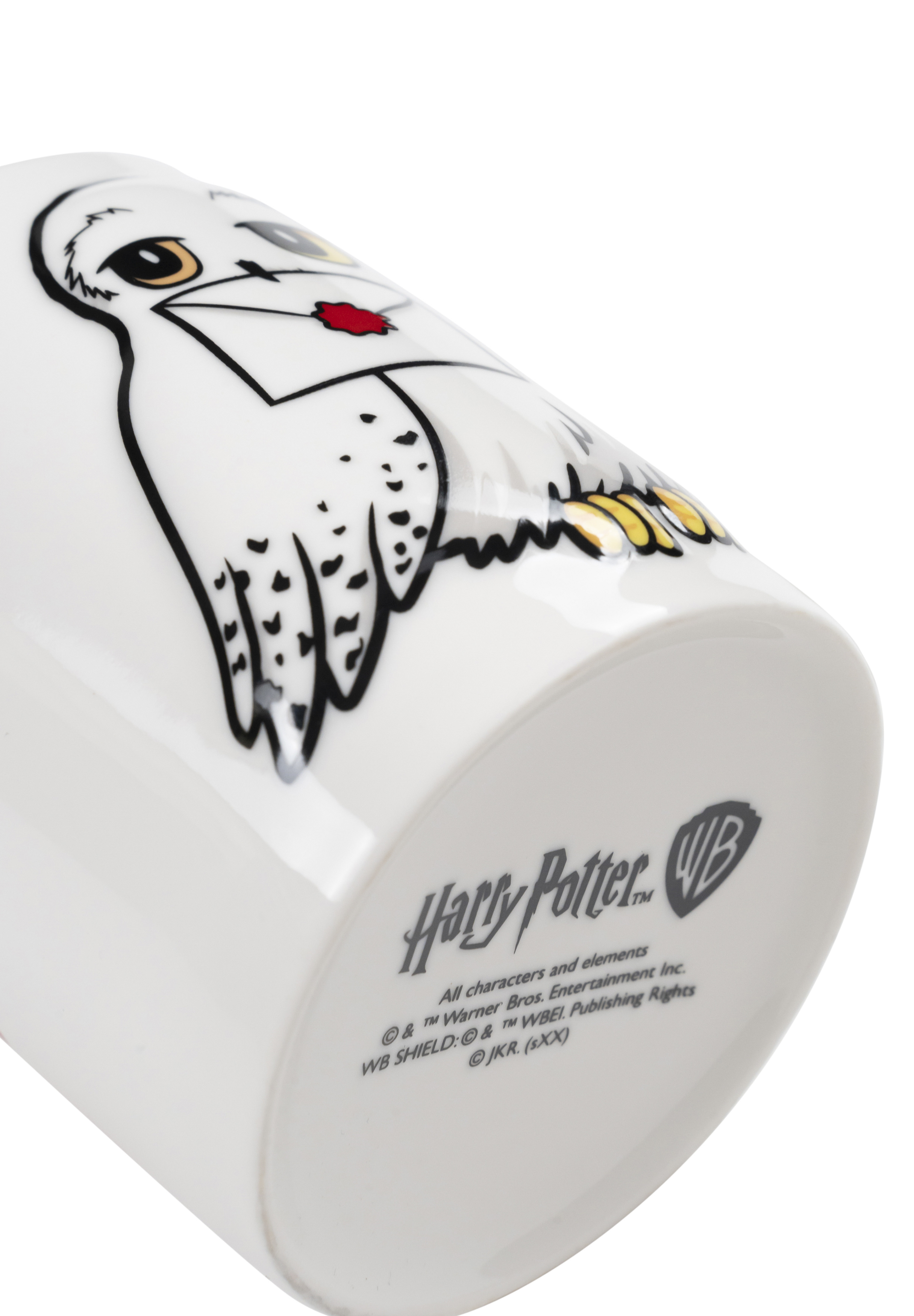 Weißer Harry Potter-Becher mit Eulen-Design. Das WB-Logo und Text sind sichtbar.
