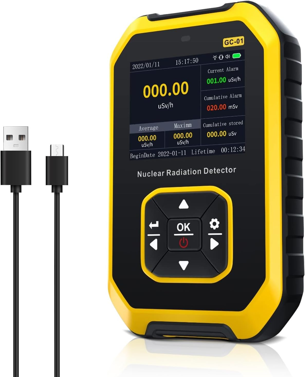 Ein gelb-schwarzer Kernstrahlungsdetektor zeigt Messwerte an. Zwei schwarze Kabel mit USB- und Micro-USB-Anschlüssen im Vordergrund.