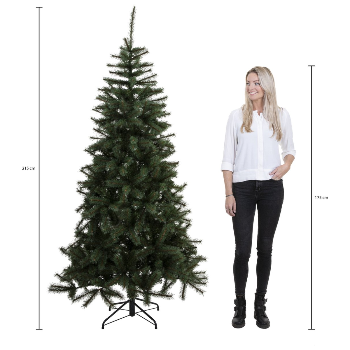 A woman stands beside a tall green Christmas tree. The tree is 215 cm, woman is 175 cm. Both are on a white background.
