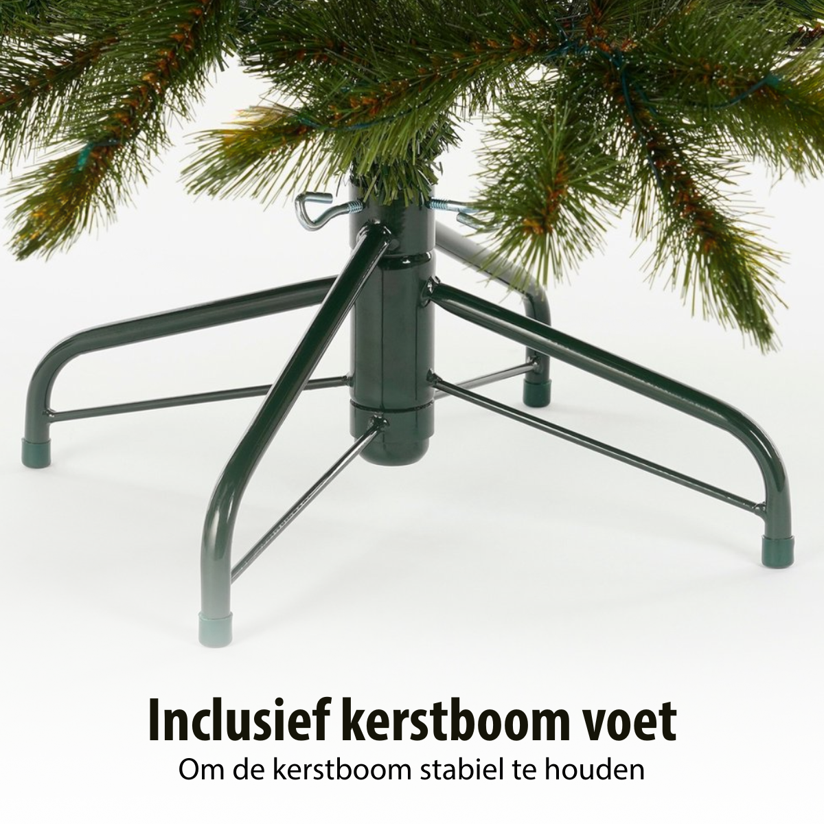 A green Christmas tree stand with a green tree. The stand is metal and has legs. The background is white.