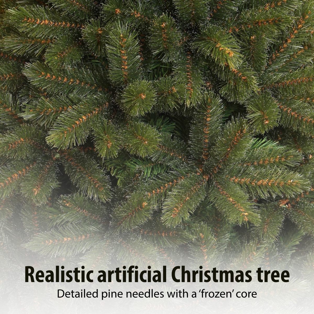 Close-up of a realistic artificial Christmas tree. Green needles with brown tips fill the frame, giving a dense texture.