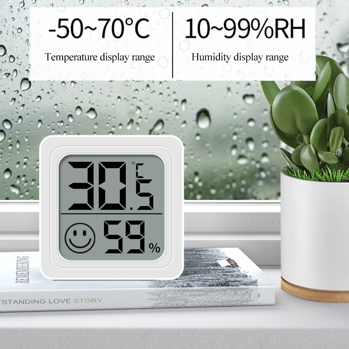 Ein weißes digitales Thermometer zeigt 30,5°C und 59 % Luftfeuchtigkeit mit einem Smiley an. Rechts ist eine Topfpflanze.