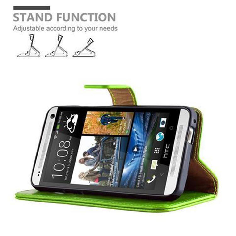Uno smartphone in una custodia verde, che mostra uno schermo con icone e ora. La custodia è aperta, mostrando il telefono supportato.