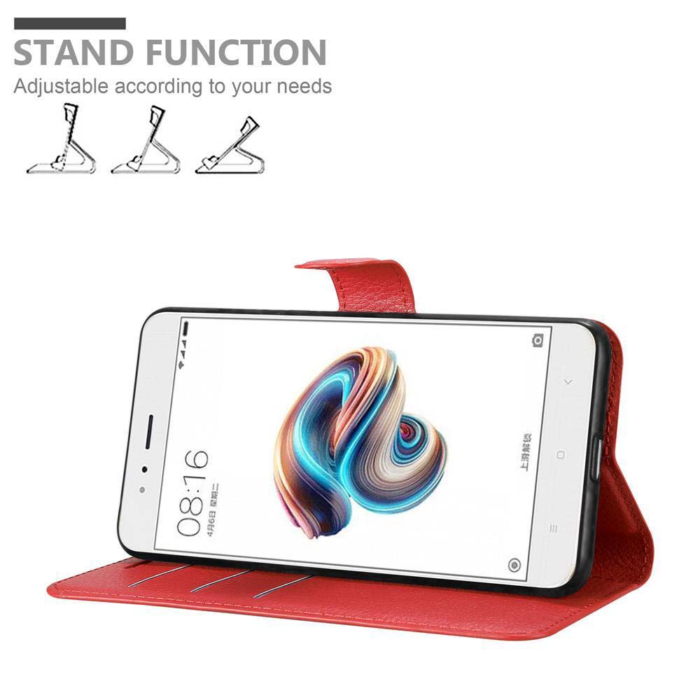 Ein Smartphone in roter Hülle wird angezeigt. Der Bildschirm zeigt ein farbenfrohes abstraktes Bild. Die Uhrzeit ist 08:16. Text sagt 'STAND FUNCTION'.