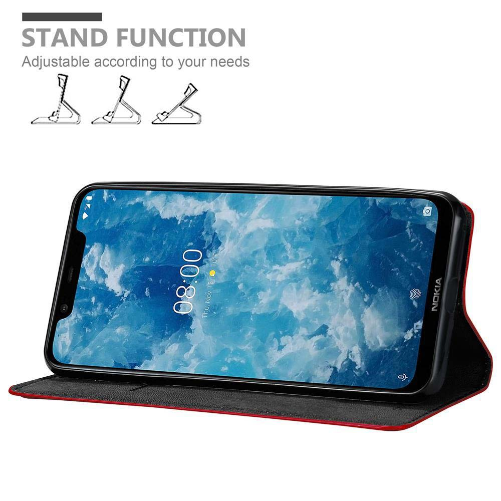 Ein Nokia-Telefon zeigt 8:00 Uhr auf dem Bildschirm. Es befindet sich in einer Hülle mit Standfunktion. Text oben: 'STAND FUNCTION...'