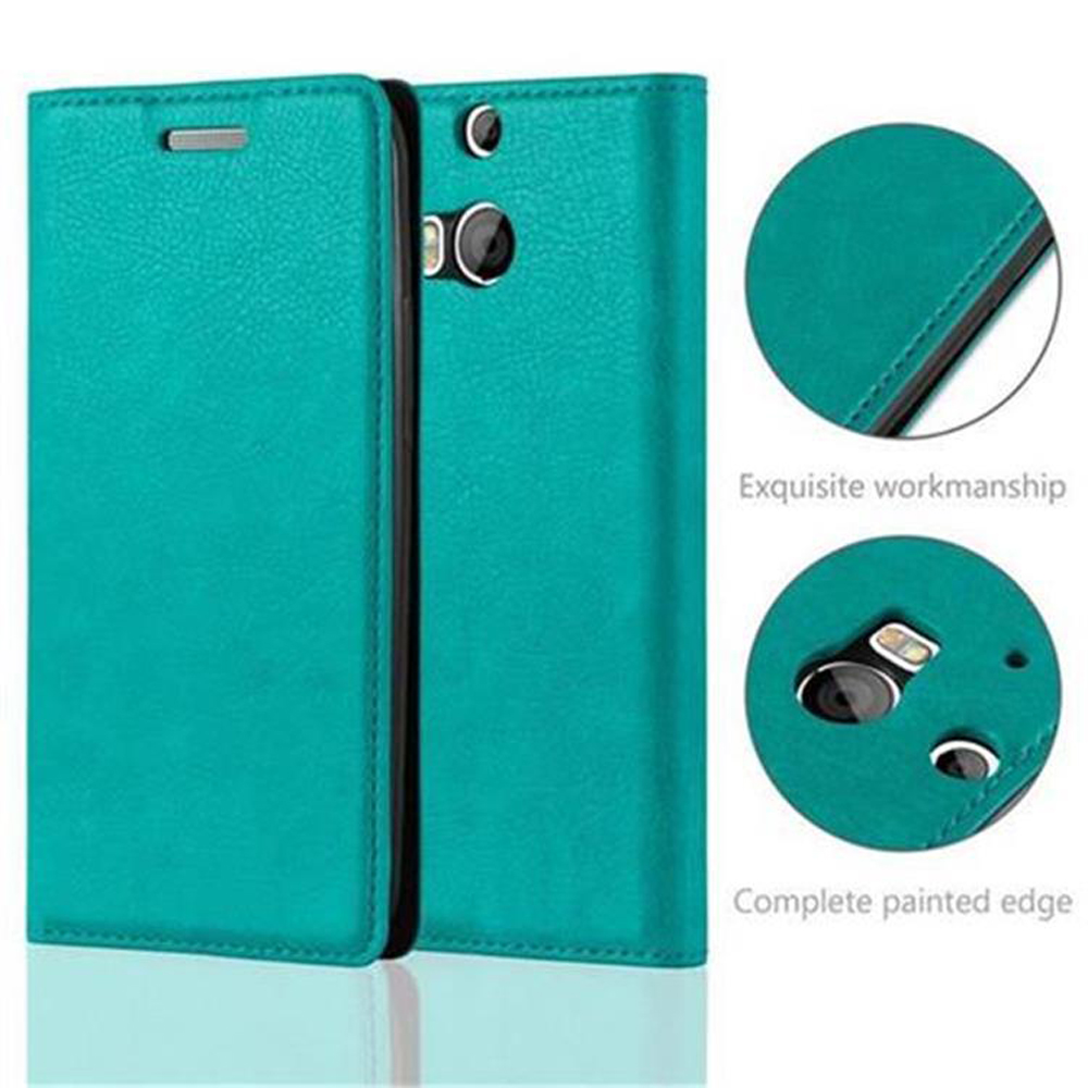 Funda de teléfono verde azulado, abierta para revelar el interior. Dos detalles circulares muestran la artesanía y un borde pintado.