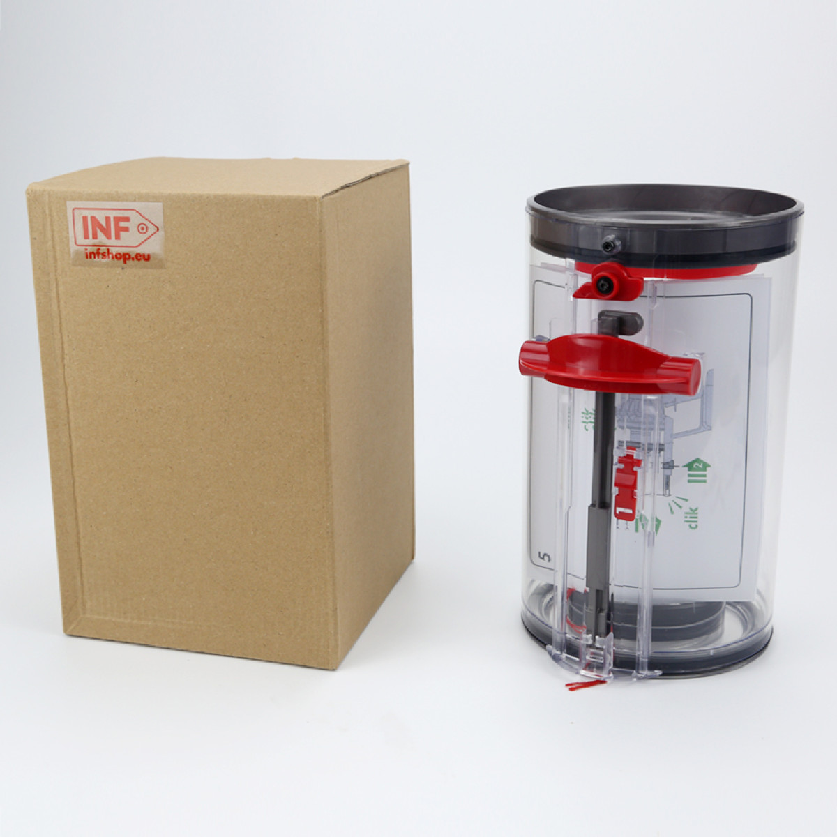 Kartonowe pudełko i przezroczysty plastikowy cylinder z czerwonymi i czarnymi akcentami na białej powierzchni. Pudełko ma naklejkę.