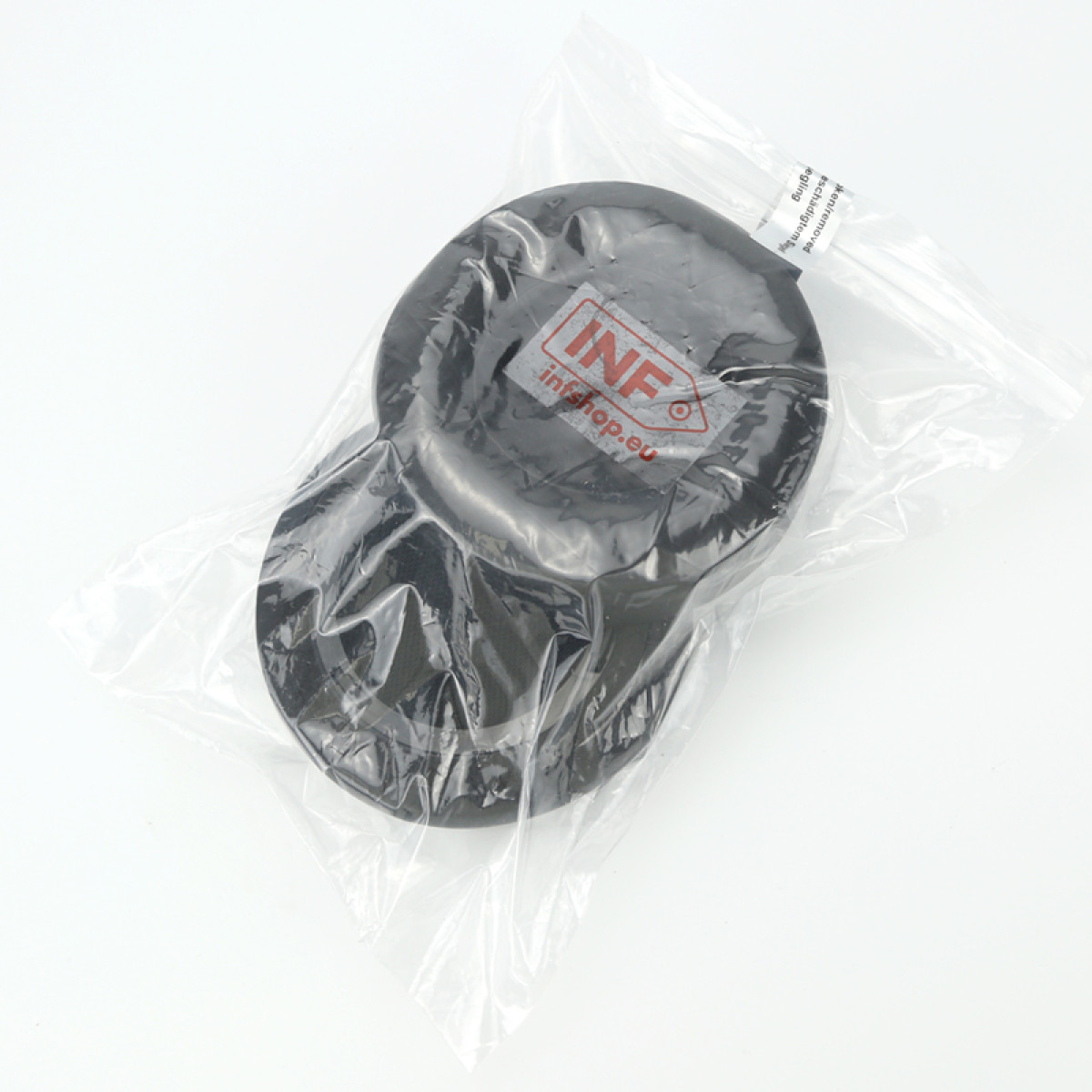 Czarny, okrągły przedmiot w przezroczystej plastikowej torbie. Przedmiot ma etykietę z napisem 'INF infshop.eu'.