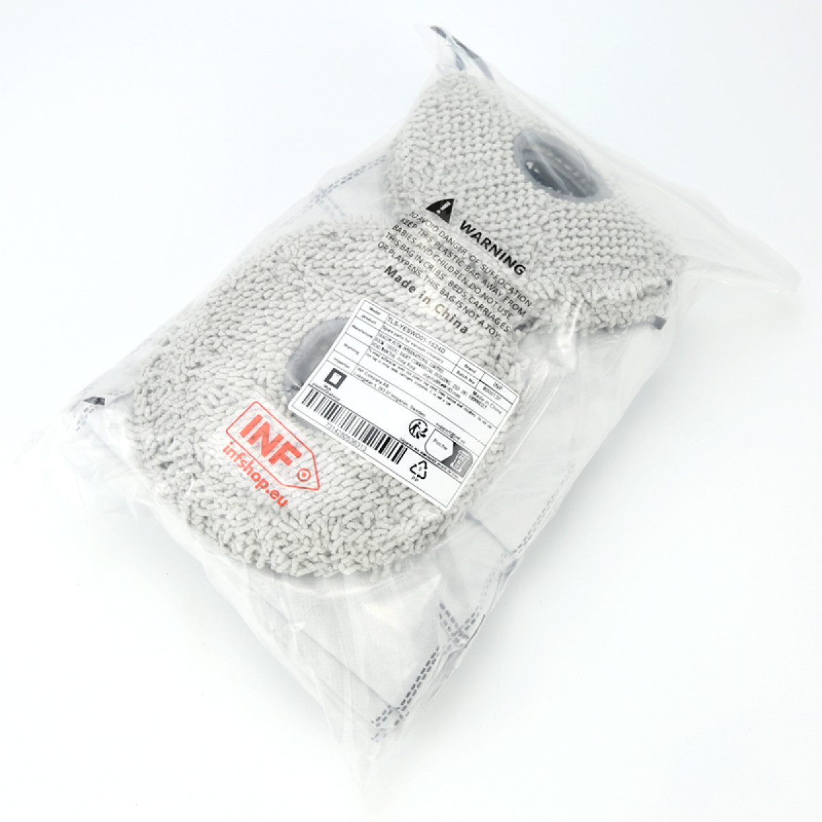 Dwie szare głowice mopa z mikrofibry w przezroczystej plastikowej torbie z etykietą ostrzegawczą i etykietą produktu.