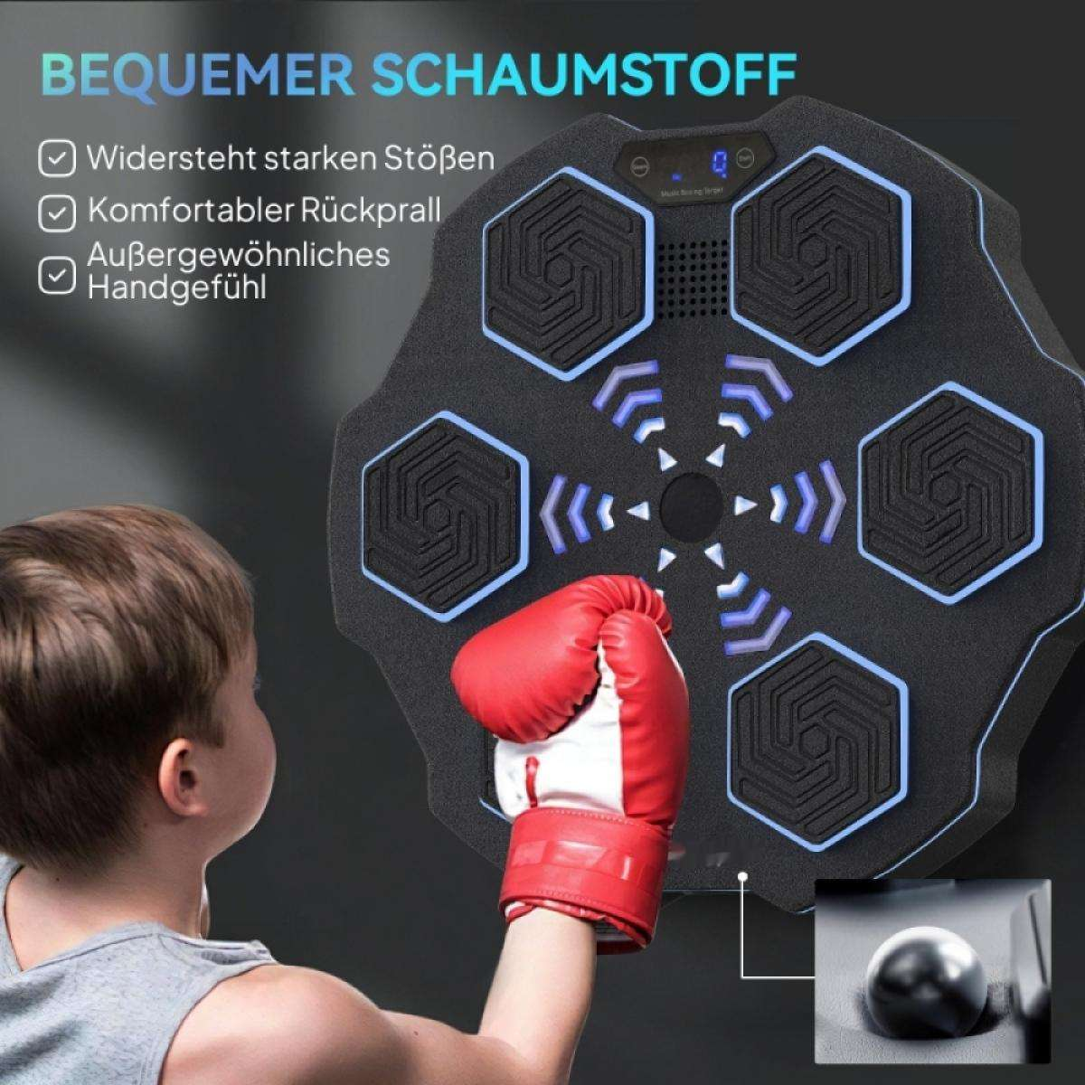 Ein Kind mit rotem Boxhandschuh steht kurz davor, auf ein schwarzes, sechseckiges Schlagziel zu schlagen. Das Ziel befindet sich an einer Wand.