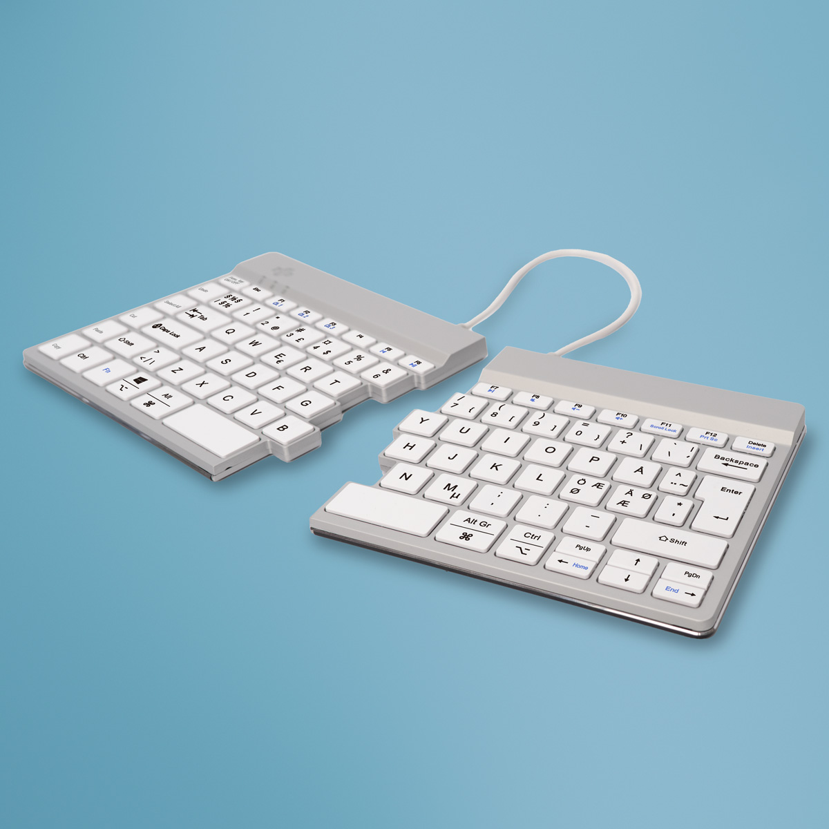 Dos teclados ergonómicos divididos sobre un fondo azul. Teclas blancas con marcos grises conectadas por un cable blanco.