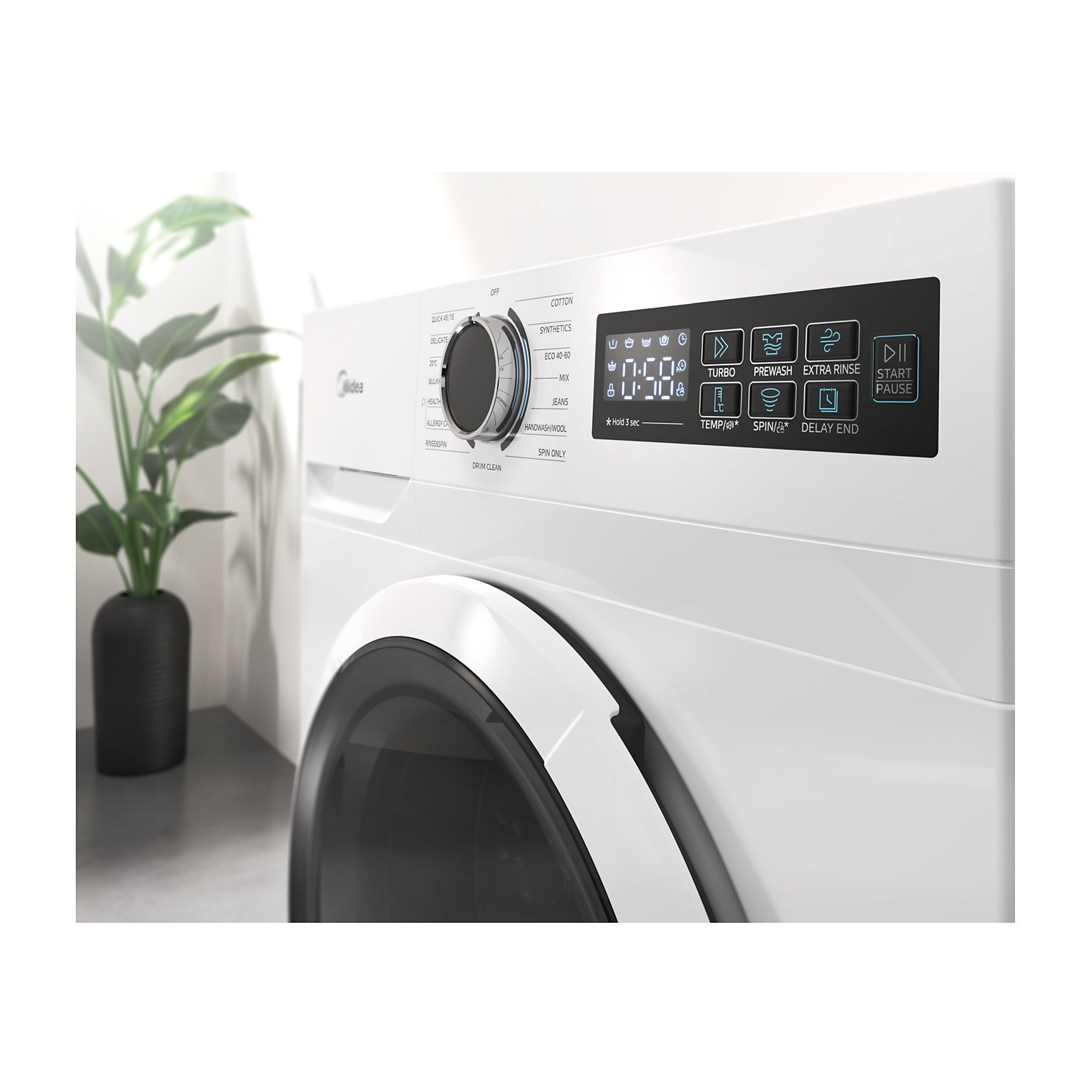 Una lavadora blanca con panel de control y pantalla digital. A la izquierda, una planta en maceta negra.