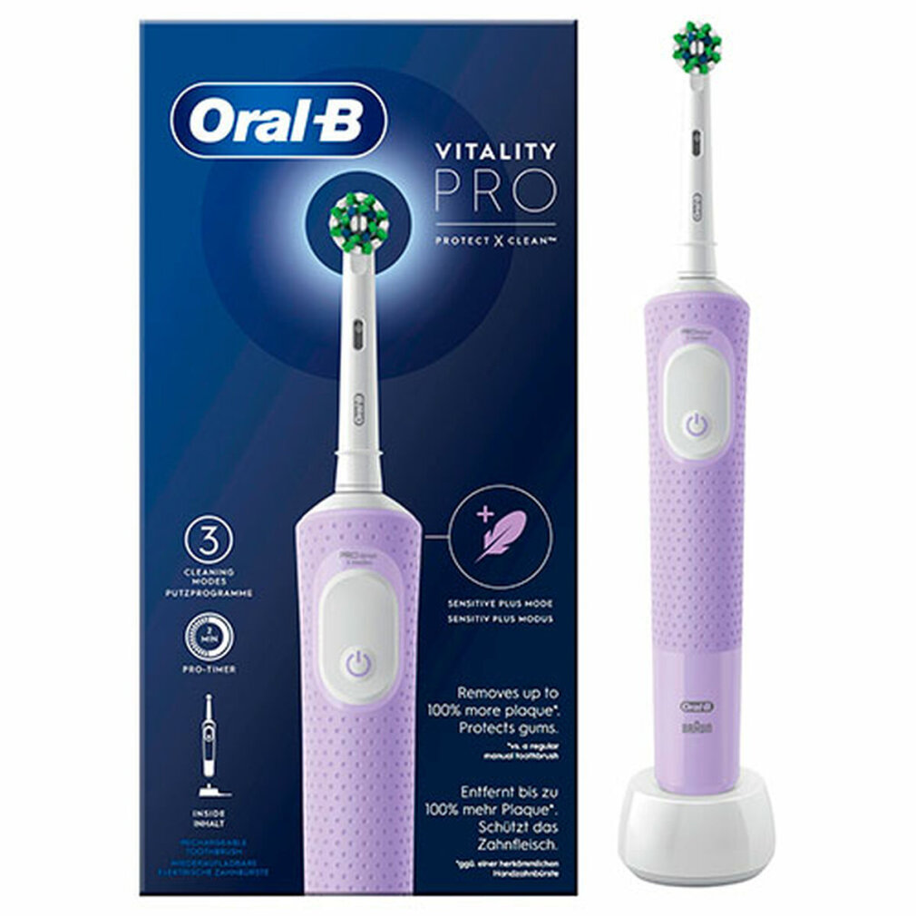 Elektryczna szczoteczka do zębów Oral-B Vitality Pro i pudełko. Szczoteczka jest fioletowa z zielono-białą główką i stoi na ładowarce.