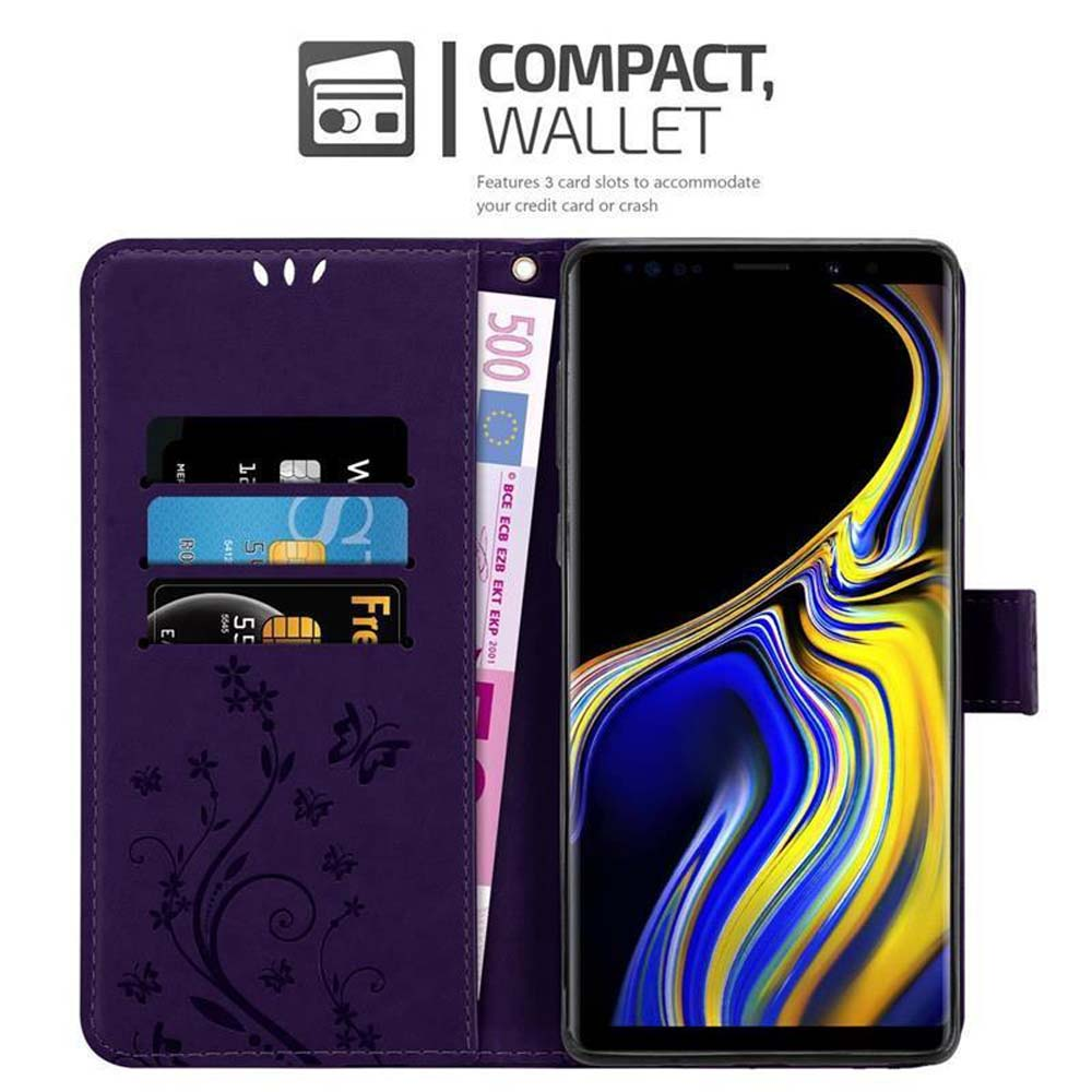 Portafoglio viola con telefono. Contiene carte e una banconota da 500 euro. Il portafoglio ha un design floreale.