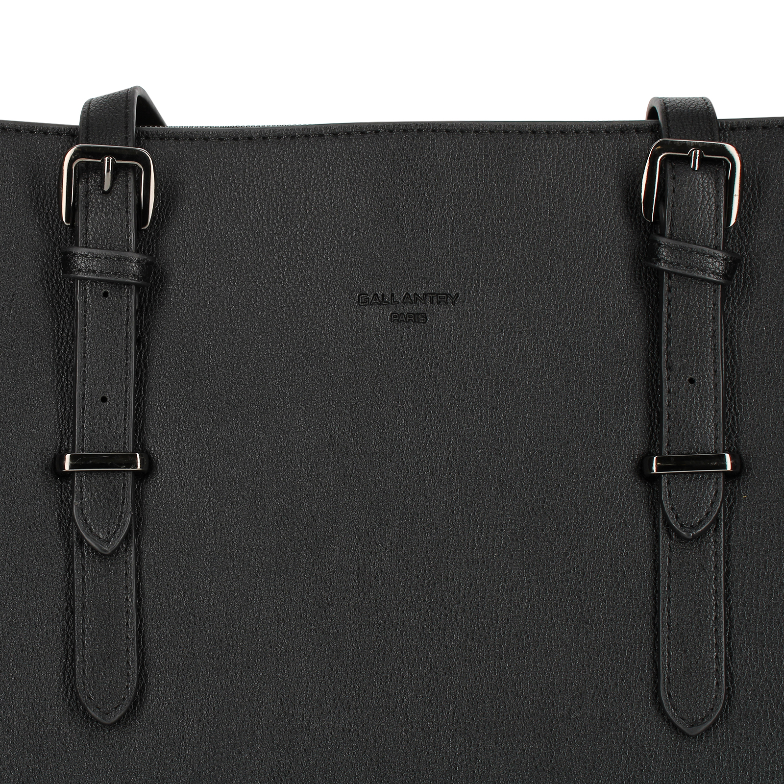 Primer plano de un bolso de cuero negro con dos correas, hebillas de metal y la marca "GALLANTRY PARIS".