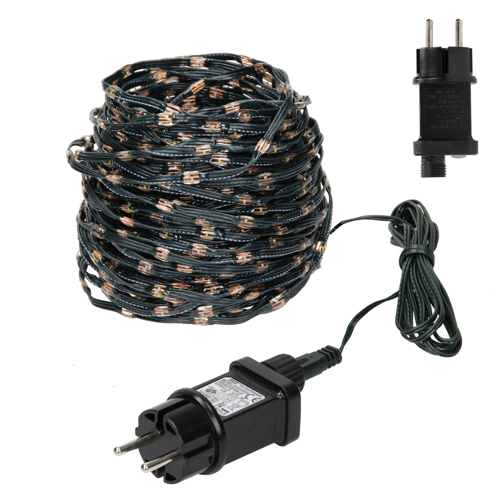 Eine aufgerollte Schnur mit grünen Lichtern, einem schwarzen Netzteil und einem separaten Stecker.
