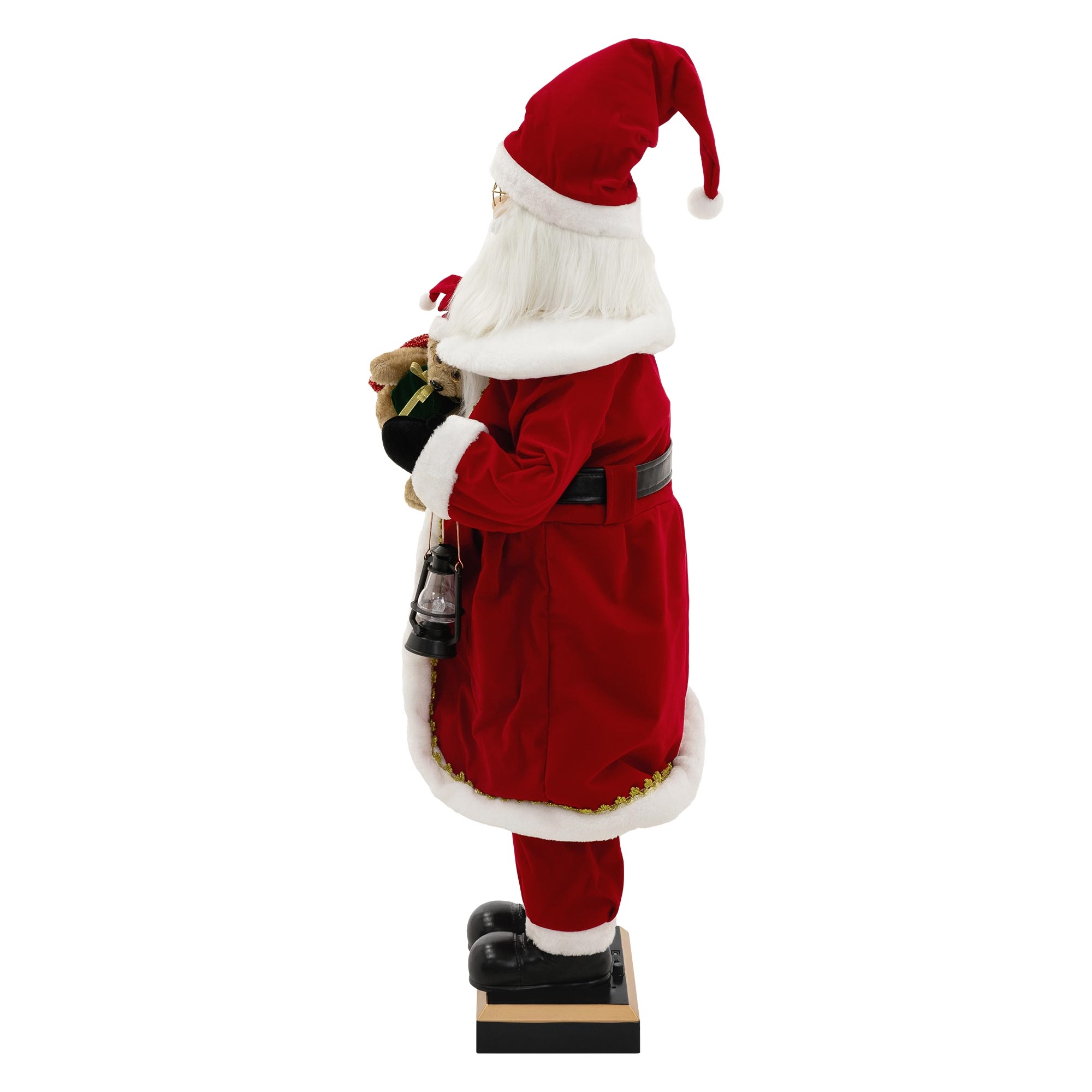 Eine Weihnachtsmannfigur in rotem Anzug, die eine Tasche und eine Laterne hält, steht auf einem schwarzen Sockel.