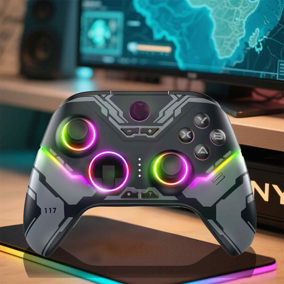Nahaufnahme eines Gaming-Controllers mit bunten Lichtern. Tasten und Joysticks sind sichtbar. Ein Monitor befindet sich im Hintergrund.