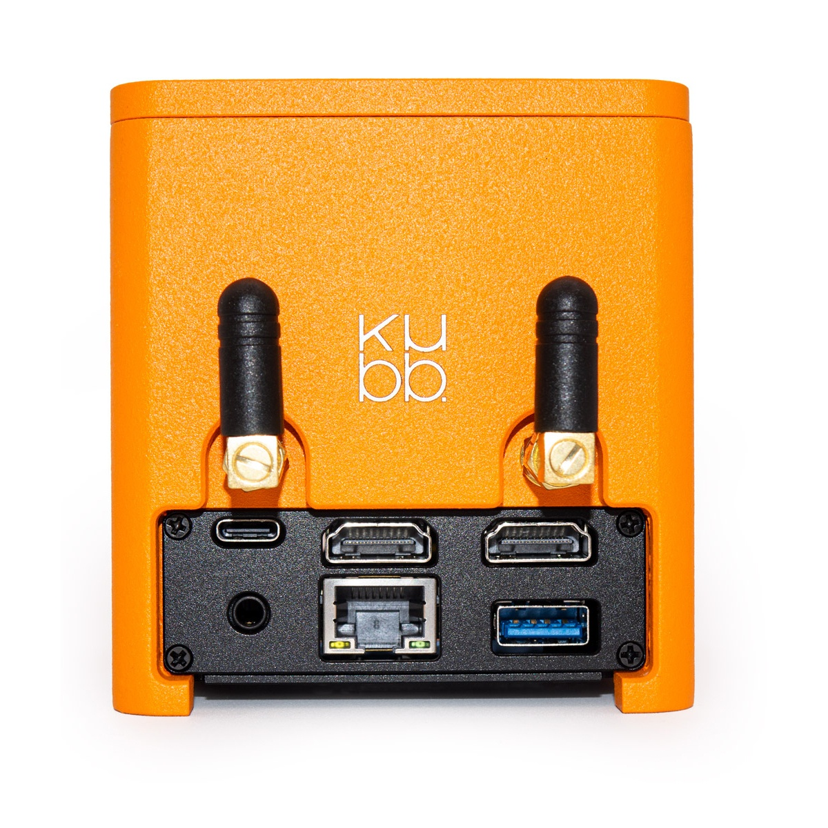 Pomarańczowe urządzenie z czarnymi portami i antenami. Na przodzie widnieje napis 'ku bb'. Różne porty to m.in. HDMI i USB.