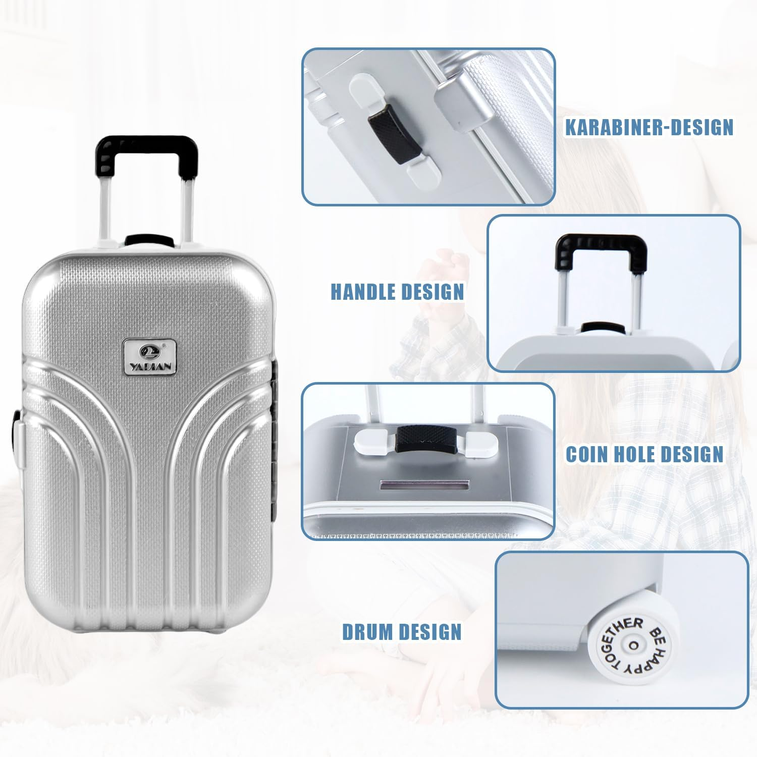 Silberner Yadian-Koffer mit ausziehbarem Griff. Detailansichten zeigen Griff, Karabiner, Münzschlitz und Trommeldesigns.