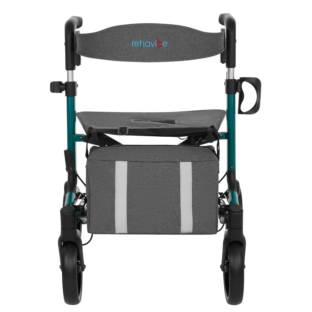 Ein grauer und türkisfarbener Rollator mit Sitz, Rückenlehne und Aufbewahrungstasche. Der Markenname 'rehavite' steht auf der Rückenlehne.
