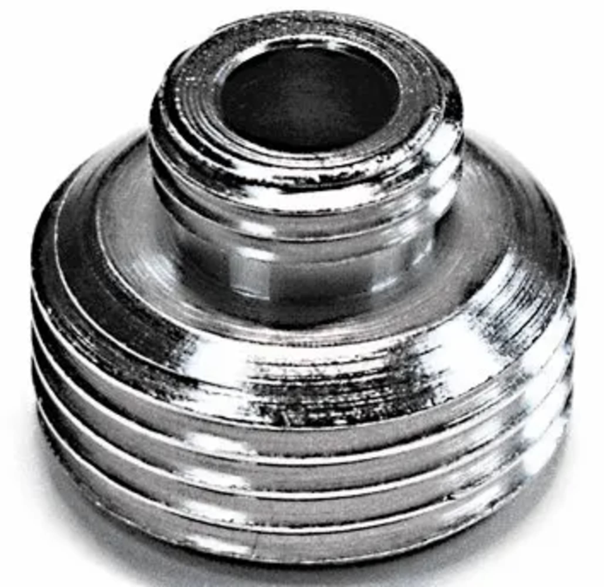 Un oggetto metallico filettato con un foro centrale. L'oggetto ha una base arrotondata e una parte superiore cilindrica.