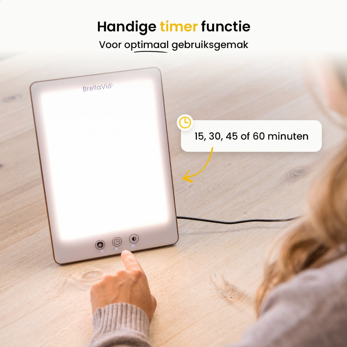A person is touching a light therapy lamp. The lamp is on a wooden table. Text says 'timer function' and timer options.