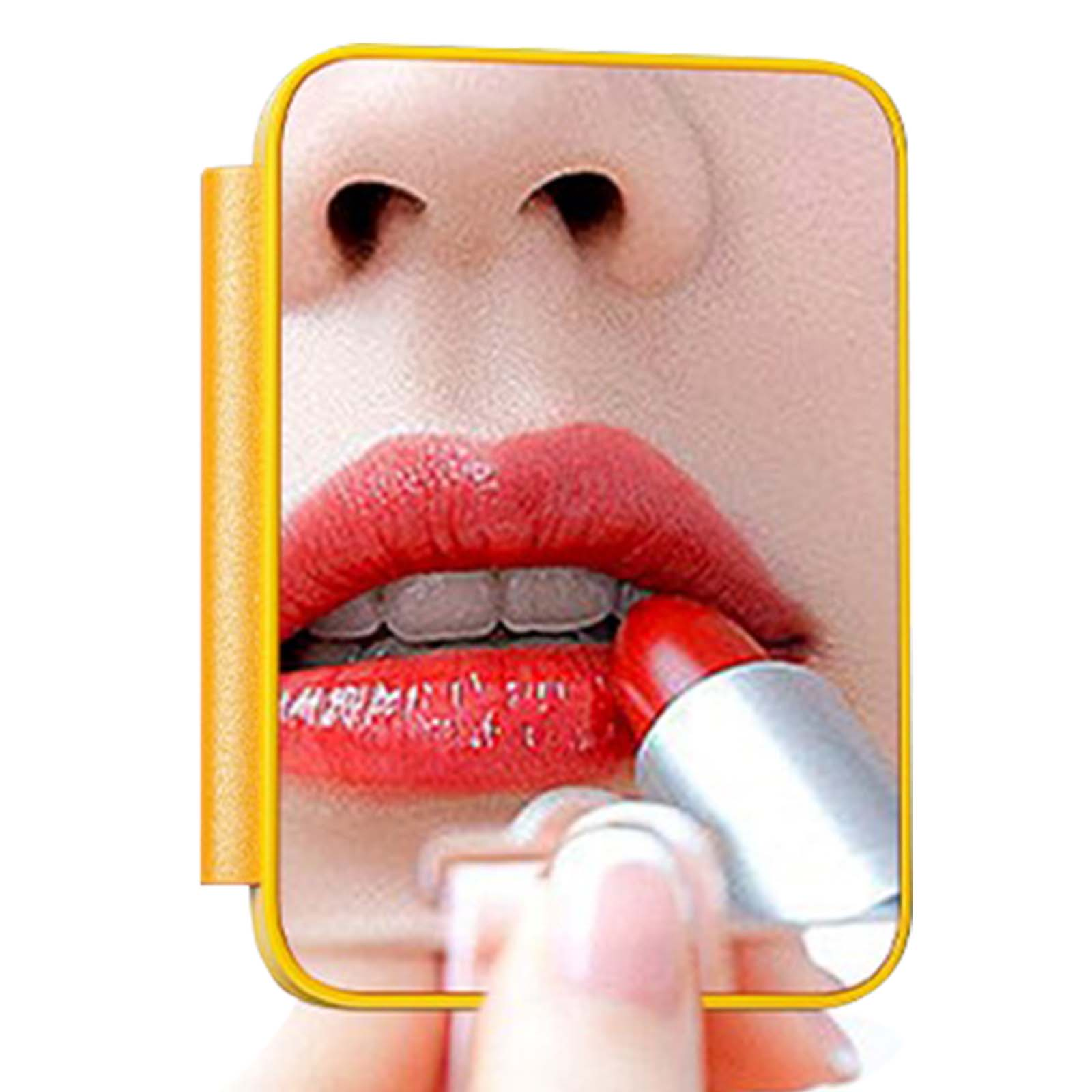 Primo piano di una persona che applica rossetto rosso. Lo specchio è incorniciato di giallo. La pelle è visibile.