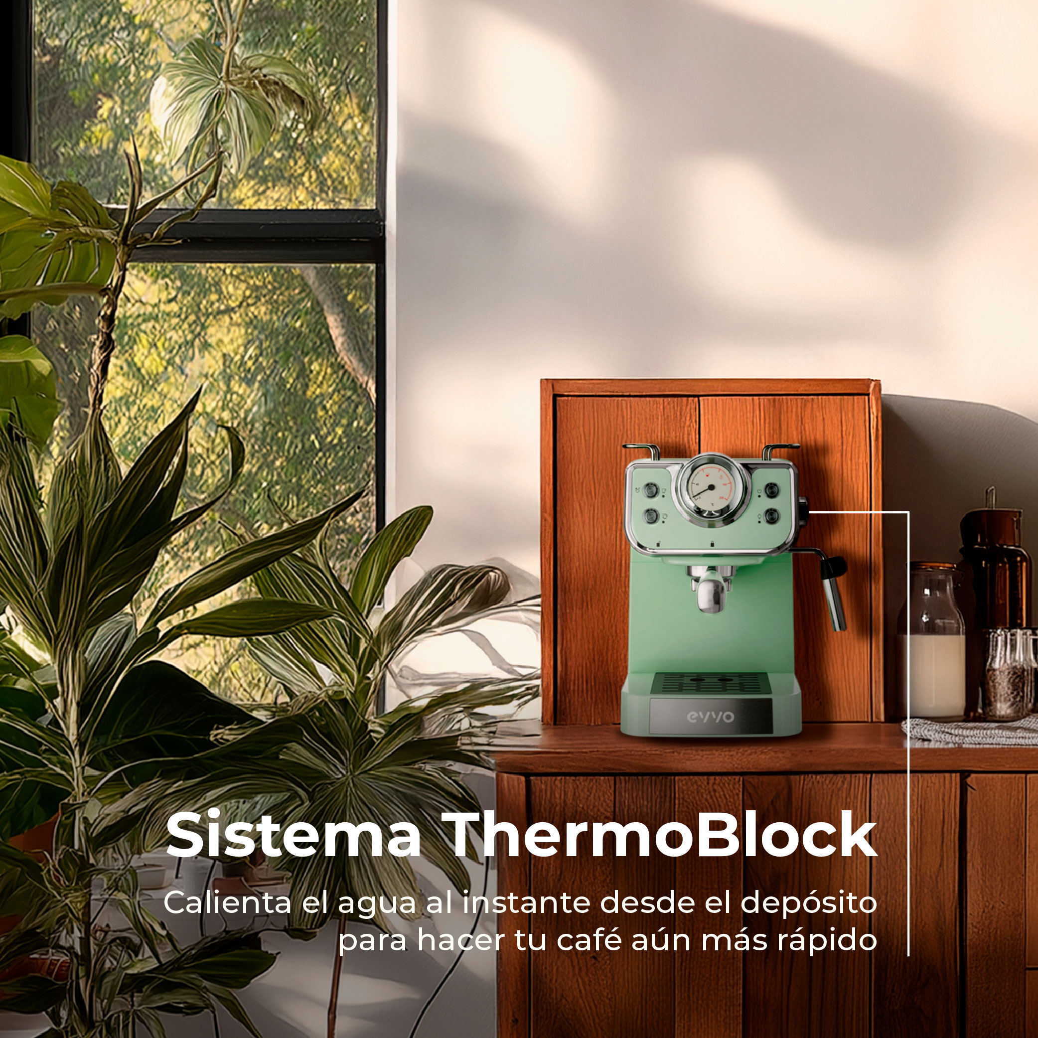 Una máquina de espresso verde menta sobre un mueble de madera, con plantas en primer plano y una ventana al fondo.