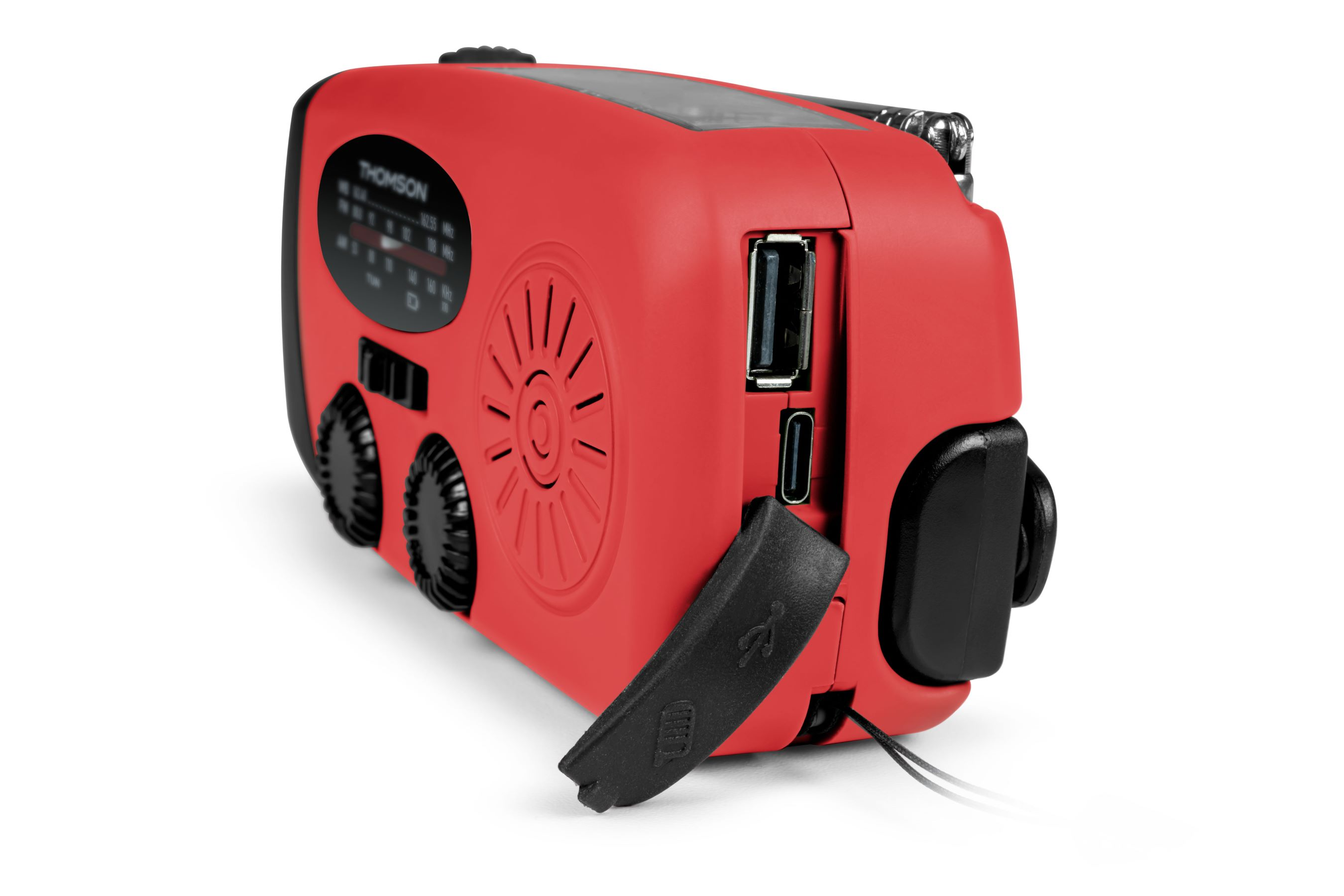 Una radio roja Thomson. Tiene un altavoz negro, diales y un puerto USB. Una cubierta negra está abierta.