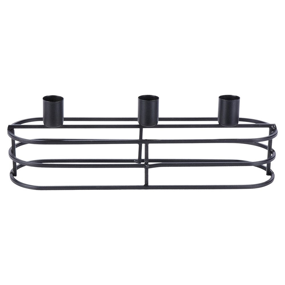 Un portavelas de metal negro con tres copas para velas. El soporte tiene una base ovalada y barras horizontales.