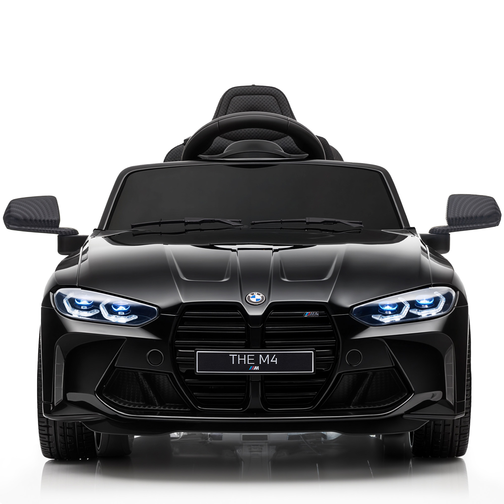 Un'auto giocattolo BMW M4 nera, vista frontale. Ha fari e un volante. Lo sfondo è bianco.