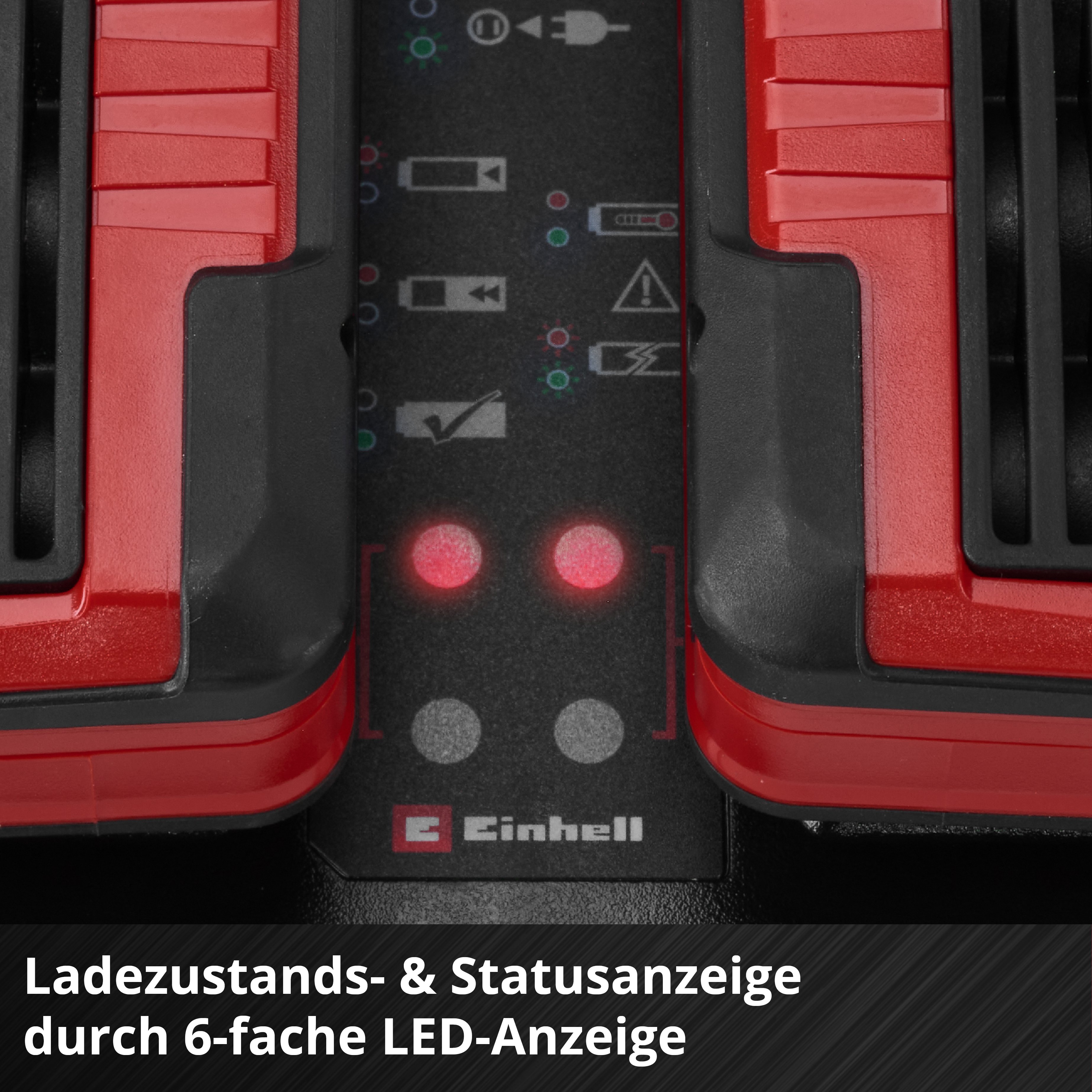 Nahaufnahme eines Ladegeräts mit roten und schwarzen Akzenten. Das Gerät hat LED-Leuchten und das Einhell-Logo.