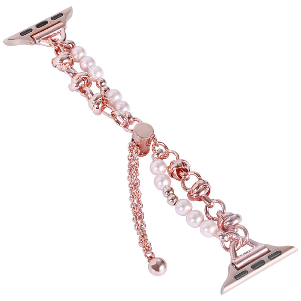 Roségoldenes Uhrenarmband mit Perlen und einer Kette. Das Band hat zwei Anschlüsse für die Uhr und dekorative Perlen.