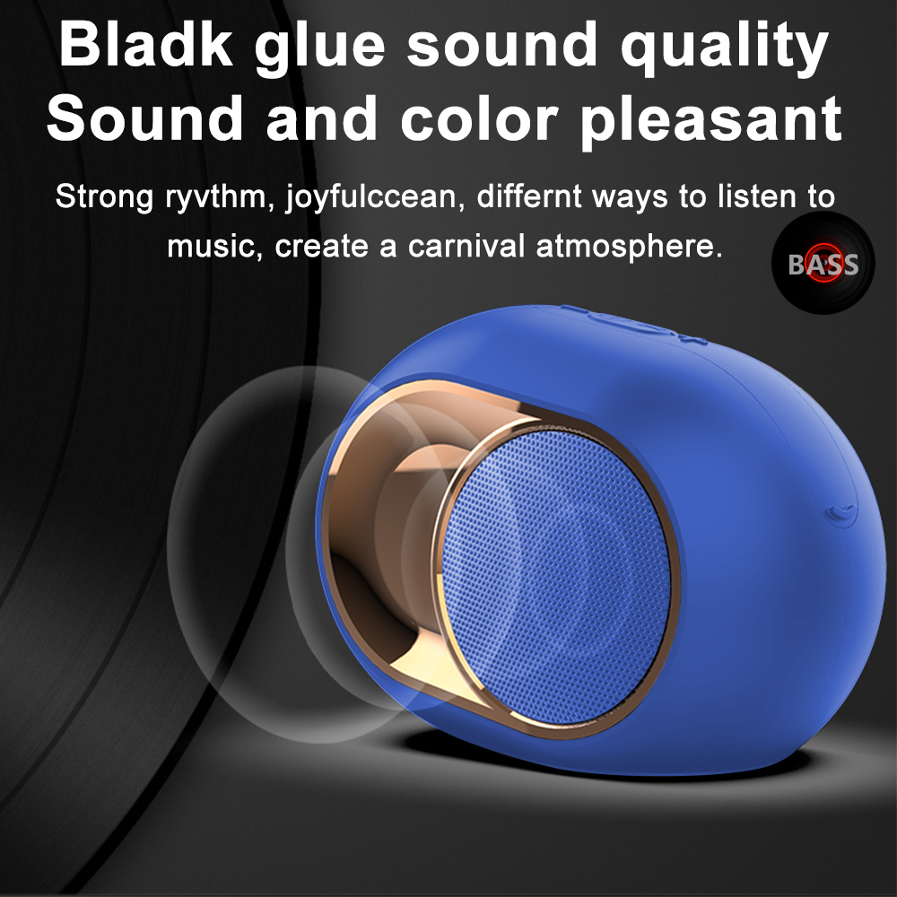 Ein blauer und goldfarbener Lautsprecher mit einem Mesh-Front. Der Text lautet 'Bladk glue sound quality' und 'BASS' ist sichtbar.