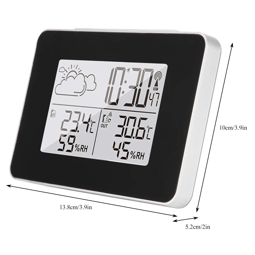 Eine digitale Wetterstation, die Zeit, Innen-/Außentemperatur und Luftfeuchtigkeit anzeigt. Das Gerät hat einen schwarzen Bildschirm und einen silbernen Rahmen.