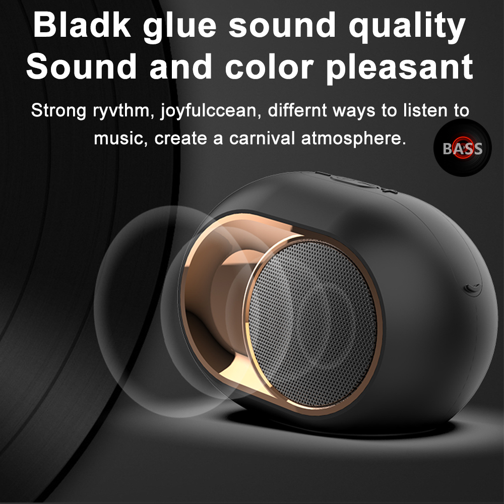 Ein schwarzer Lautsprecher mit goldfarbenem Besatz. Der Lautsprecher steht auf einer schwarzen Oberfläche. Der Text lautet "Sound and color pleasant."
