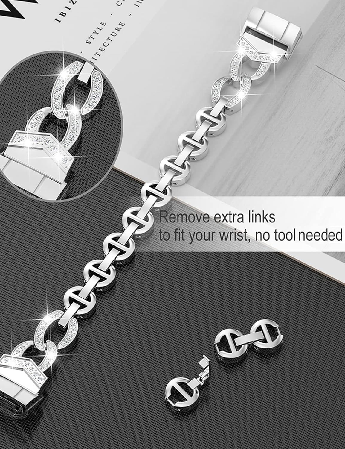 Silbernes Armband mit Gliedern, einige mit Kristallen. Zwei abgetrennte Glieder darunter. Text: 'Extra Glieder entfernen...kein Werkzeug'.