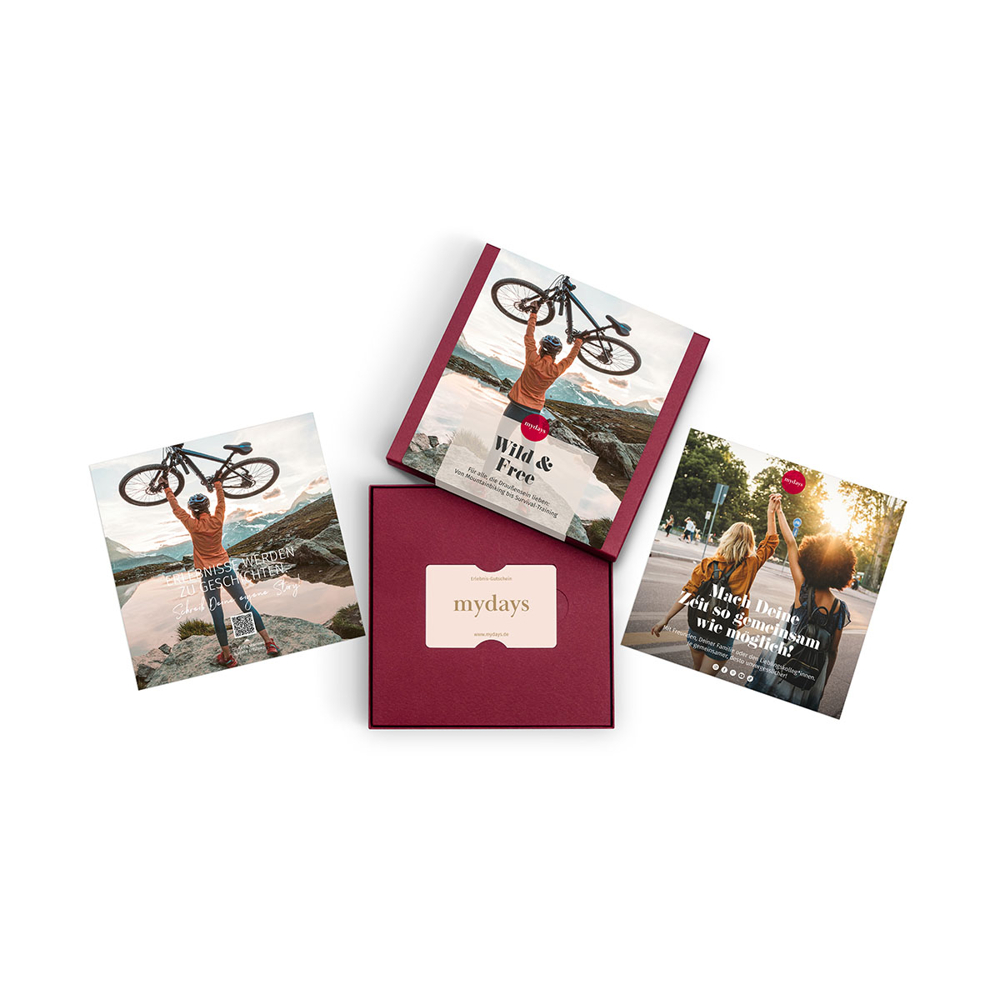 Vier Werbekarten und eine Box. Karten zeigen Menschen mit Fahrrädern und zwei Frauen. Box hat eine Geschenkkarte und das "mydays" Logo.