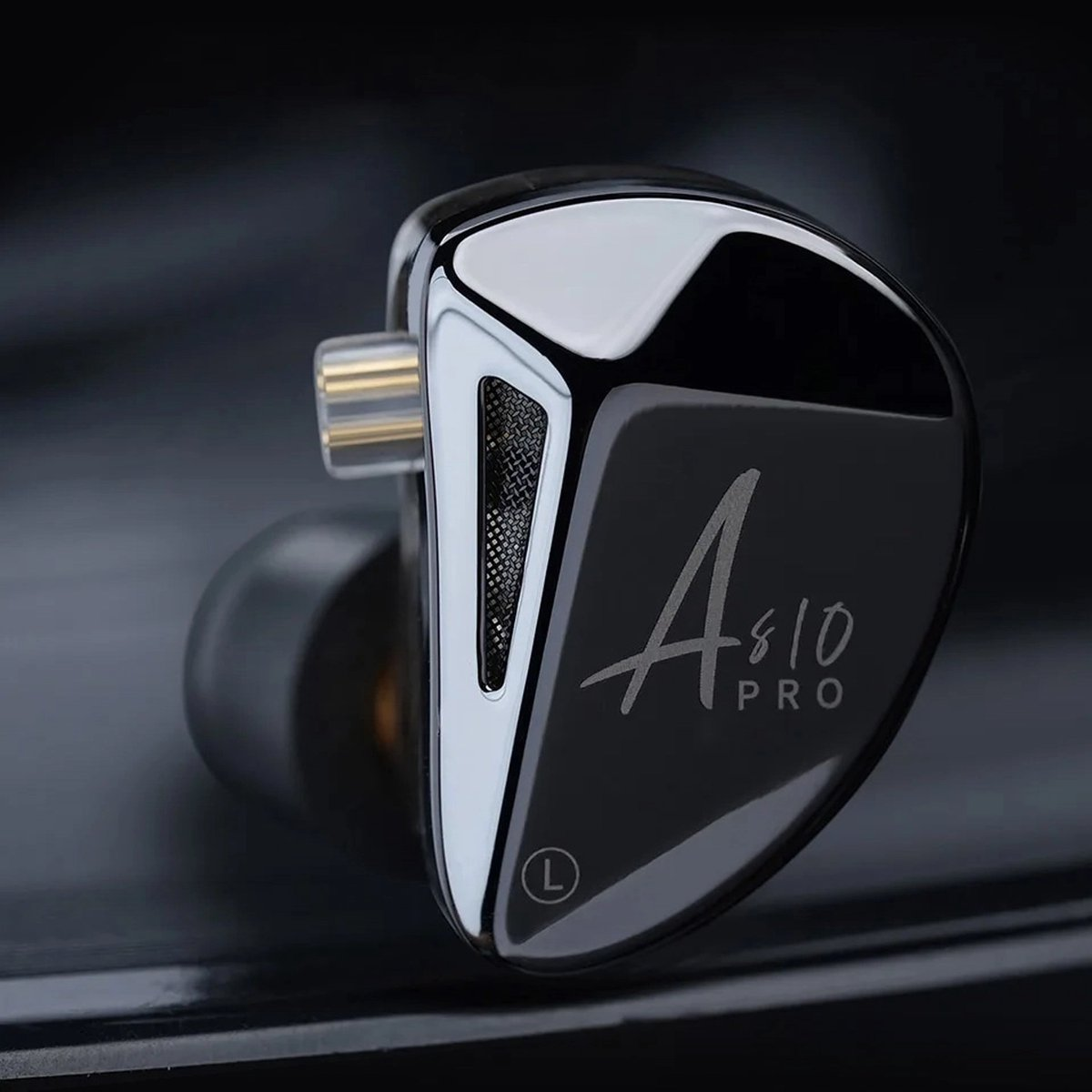 Close-up of a black earbud with silver accents. The text 'A810 PRO' is visible. The earbud is labeled with an 'L'.