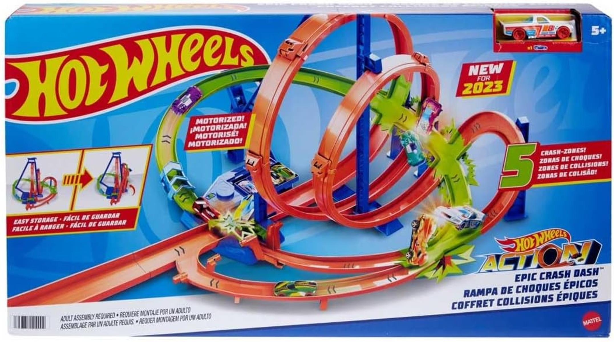 Zestaw torów Hot Wheels Action, pomarańczowe pętle, zielone strefy zderzeń, z samochodami. Pudełko zawiera szczegóły produktu i wiek 5+.