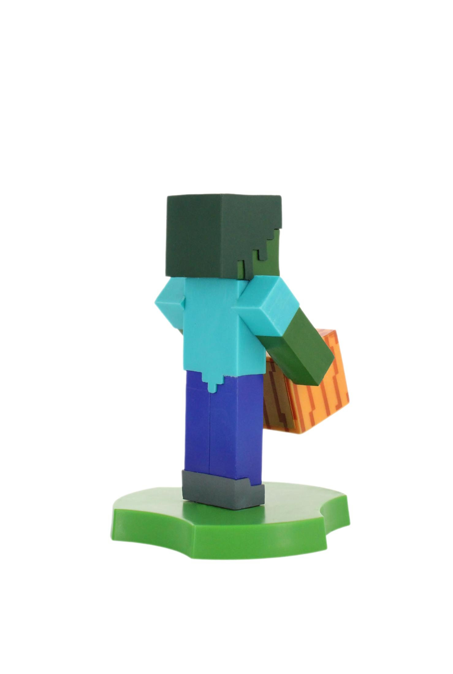 Eine Minecraft-Zombie-Figur mit grünem Kopf und Arm, blauem Hemd und Hose, hält einen Block. Sie steht auf einer grünen Basis.