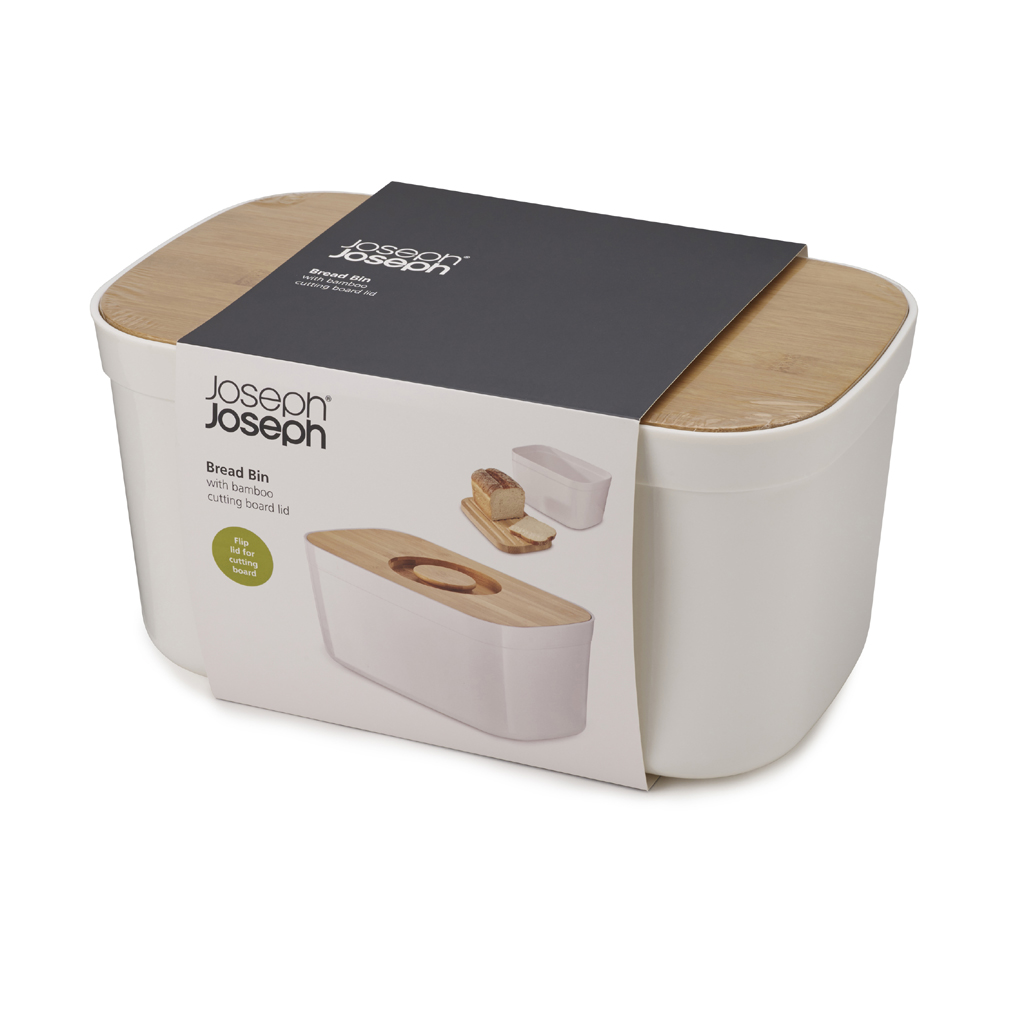 Ein weißer Brotkasten mit Bambusdeckel und einem Verpackungsetikett mit der Marke Joseph Joseph und Produktinformationen.