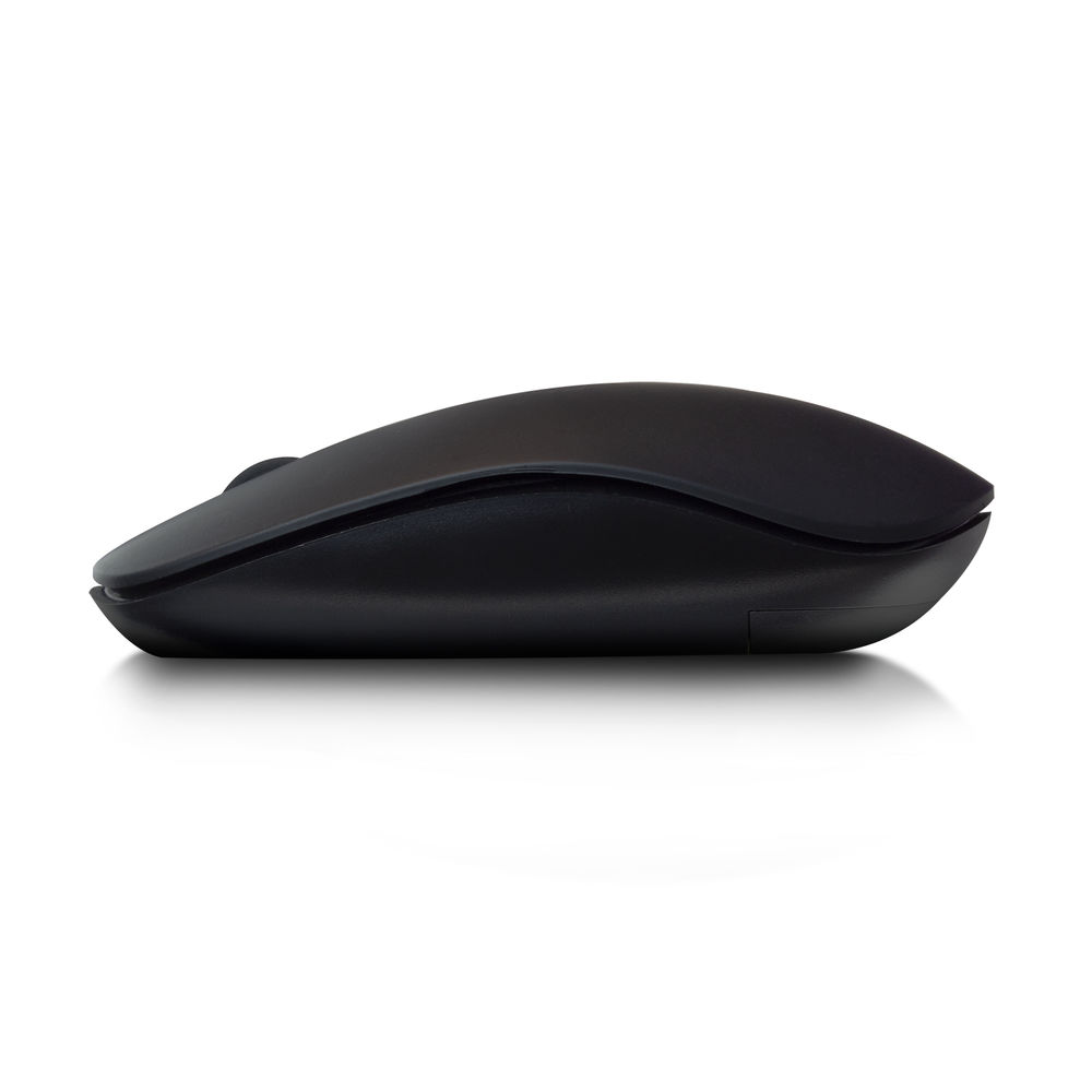 A black wireless computer mouse is on a white surface. It is in profile, showing the top and side. A shadow is below.