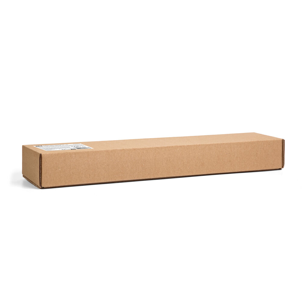A long, rectangular cardboard box, brown in color, sits on a white surface. A label is on the top left of the box.